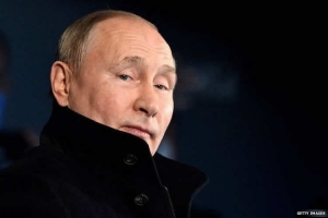 Put Putin on trial